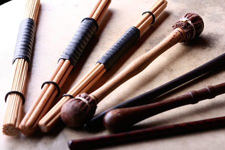 beige sticks and drum sticks on table thumbnail