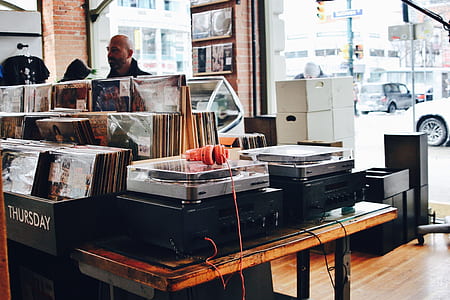 two gray turntables on black audio receivers thumbnail