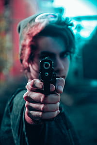 man holding gun thumbnail