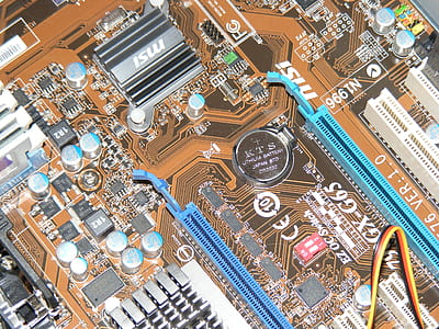 close-up photo of blue and brown computer motherboard thumbnail