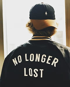 man wearing black and white no longer lost-printed jacket thumbnail