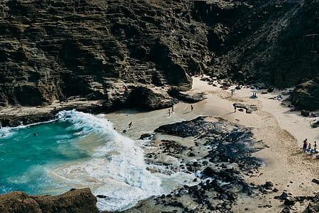aerial photography of seashore near mountain thumbnail