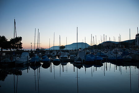 white sailboats on water thumbnail