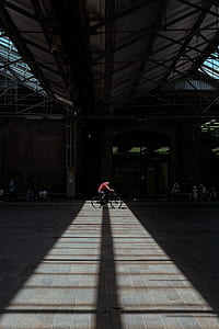 person riding bicycle during daytime thumbnail