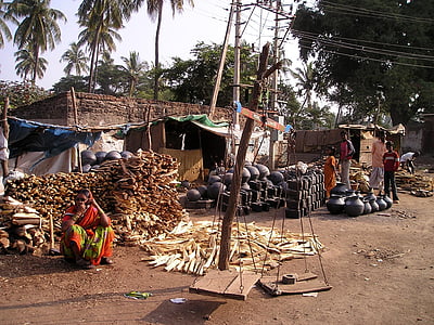 firewood and clay pot piled outside the house thumbnail