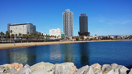 gray rock near body of water at daytime thumbnail
