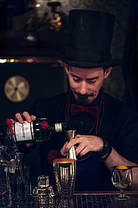 person pouring liquor on jigger thumbnail