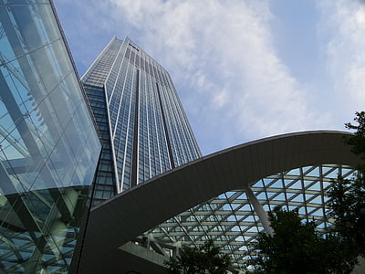 low-angle photography of high-rise glass building under white clouds and blue sky thumbnail