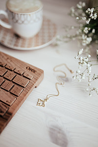Wooden keyboard and cup of coffee thumbnail