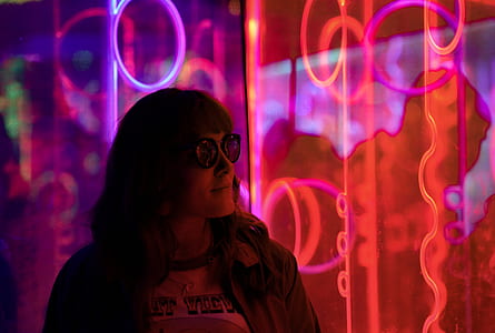 woman on front of red and purple lights thumbnail