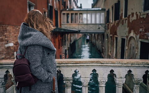 woman standing on bridge thumbnail