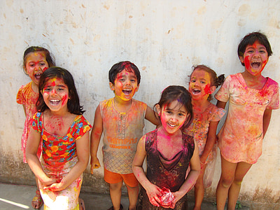 group of children wearing paint standing near wall thumbnail