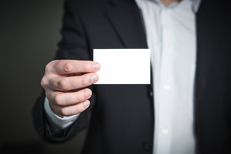 person holds white card thumbnail