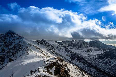 snow covered mountain during daytime thumbnail