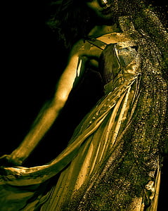 woman wearing gold dress thumbnail