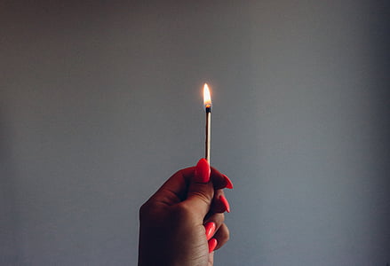 person holding a burning matchstick thumbnail