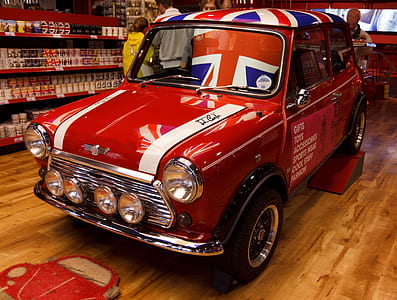 classic red MINI Cooper 3-door hatchback parked inside the store thumbnail
