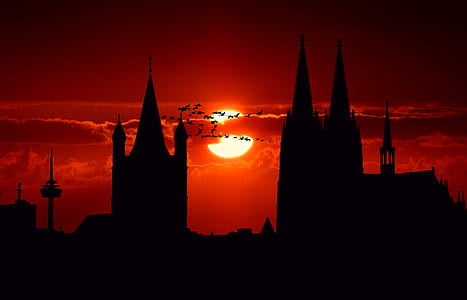 cathedral silhouette under clear sky during daytime thumbnail