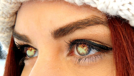 photo of woman's eyes reflecting fire thumbnail