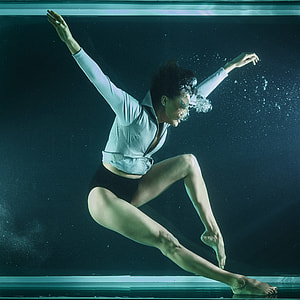 woman in white shirt and black panty in body of water thumbnail
