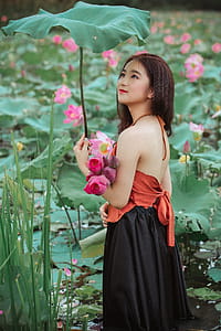 Woman Holding Big Leaf thumbnail
