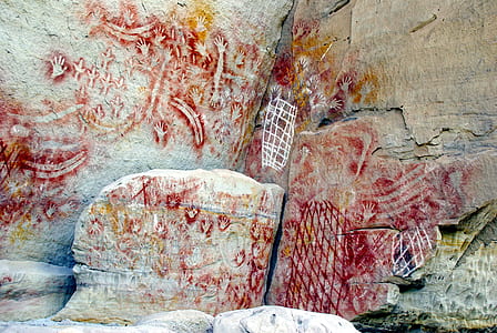 red paint on gray stones thumbnail