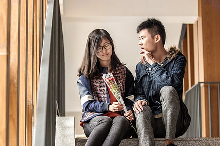 couple sitting on ladder thumbnail