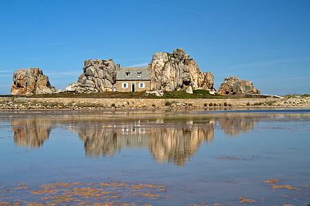 brown and gray house on island thumbnail