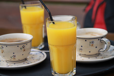 selective focus photography of mango juice inside highball glass thumbnail