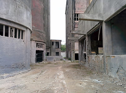 road between concrete buildings thumbnail