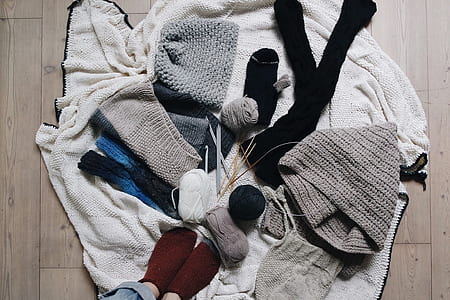 assorted clothes on white towel thumbnail