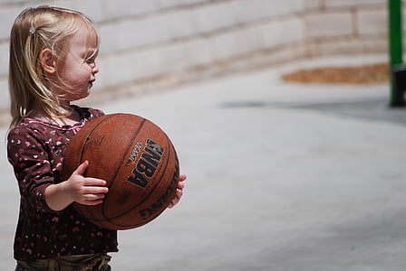 girl carrying basketball thumbnail