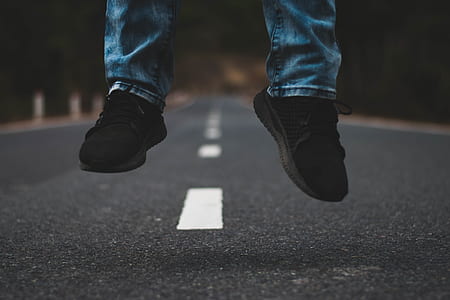person wearing black sneakers thumbnail