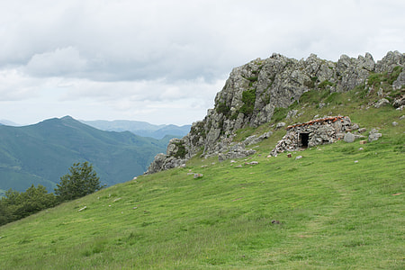 green and gray mountain under white clouds at daytime thumbnail