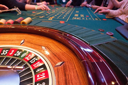 people surrounding poker table thumbnail