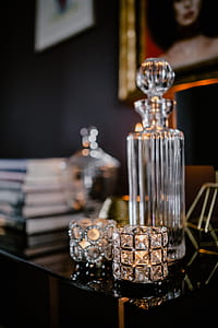 Decanter, candles, and a painting on the wall thumbnail