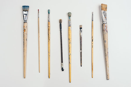 Paint brushes on grey background thumbnail