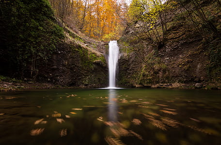 Low Angle Photo of Waterfalls Surrounded by Trees thumbnail