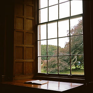 book on brown wooden surface during daytime thumbnail