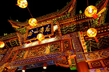 chinese temple gate with lighted lanterns thumbnail