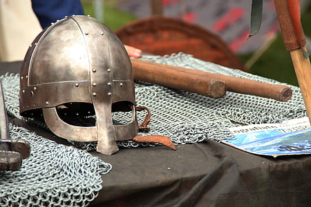 grey metal knight helmet and chainmail on black textile thumbnail