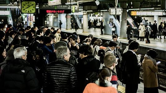 group of people at the train station thumbnail
