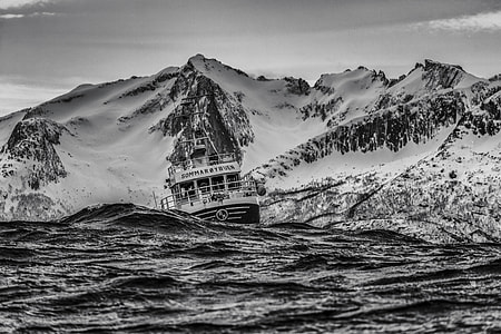 grayscale photograph of boat in body of water thumbnail