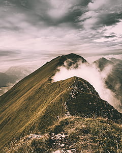 bird's eye photography of mountain with fogs thumbnail