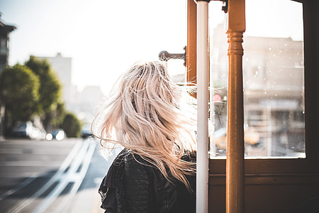Young Woman Enjoying Ride on an Iconic Cable Car in San Francisco #2 thumbnail