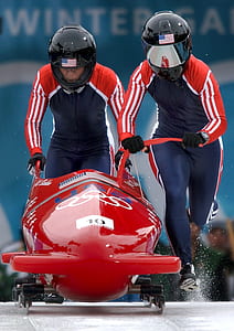 two people riding snow mobile thumbnail