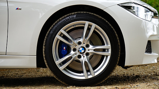 white BMW car with gray 5-spoke wheel and tire thumbnail