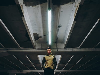 man standing inside building thumbnail