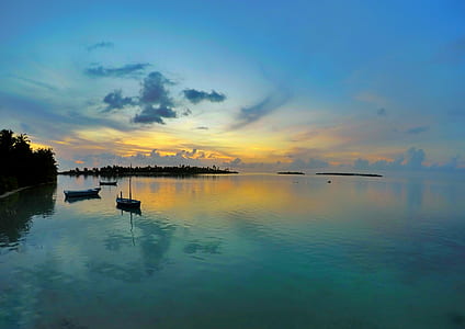 body of water under blue sky thumbnail