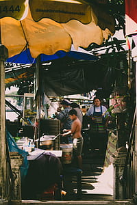 Boy Cooks in Front of Stove Outdoors thumbnail